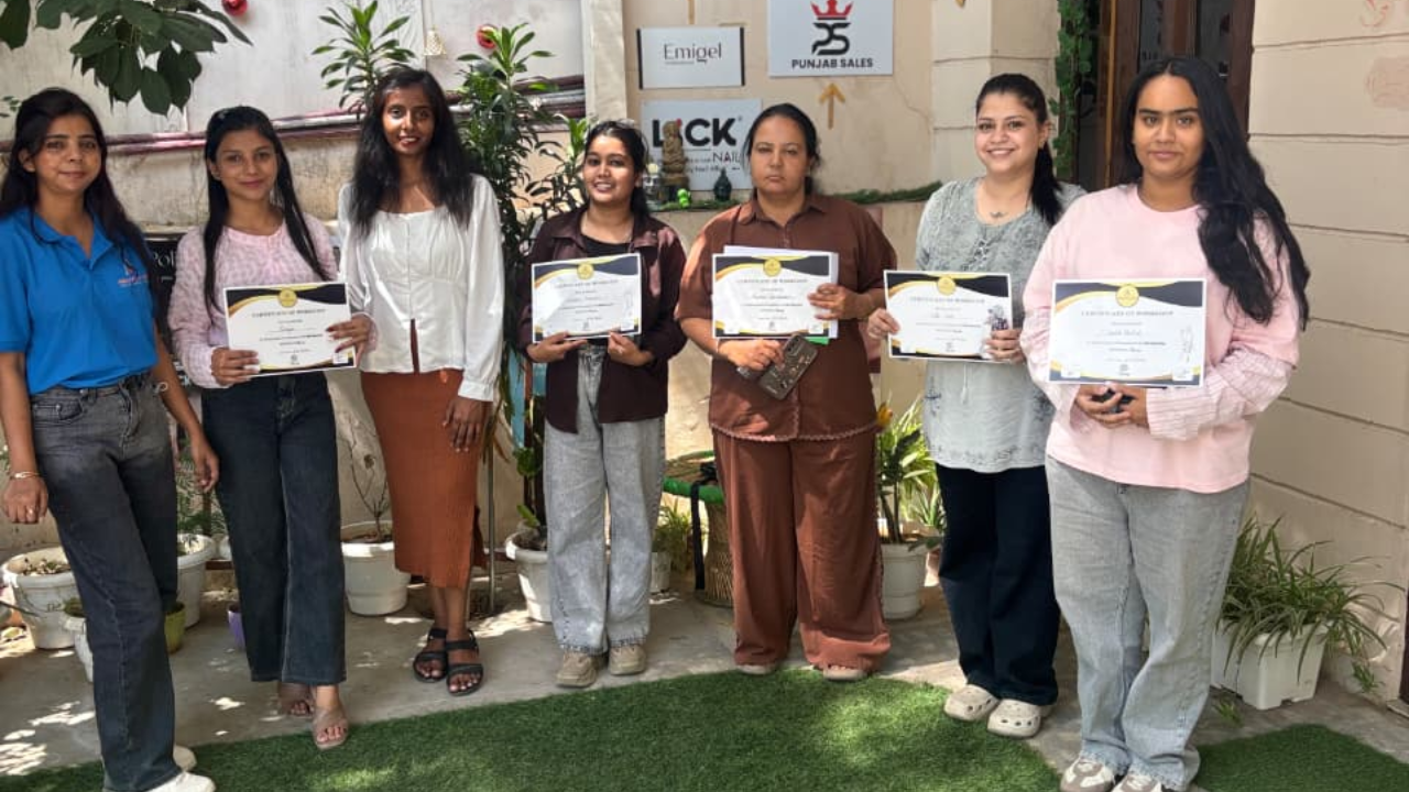 Group of participants with their nail workshop certificates